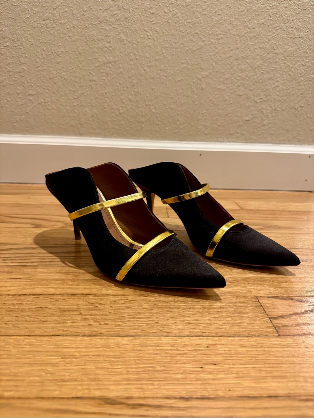 Malone Souliers Maureen Pumps. Black Pointed-Toe Mule Heels with Gold Straps